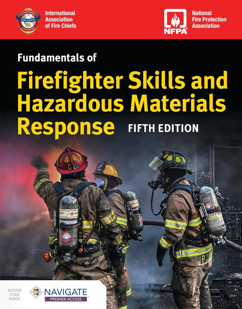 Three firefighters in full gear respond to a burning scene with smoke and flames. The book cover reads, "Fundamentals of Firefighter Skills and Hazardous Materials Response, Fifth Edition." Logos and access info are included.